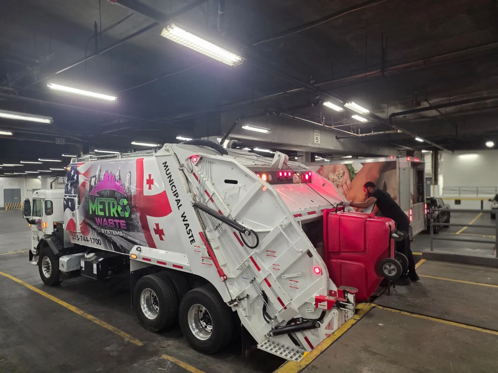 Inside Metro Waste Solutions fleet maintenance facility — commercial garbage trucks serviced for Philadelphia metro routes — photo 1
