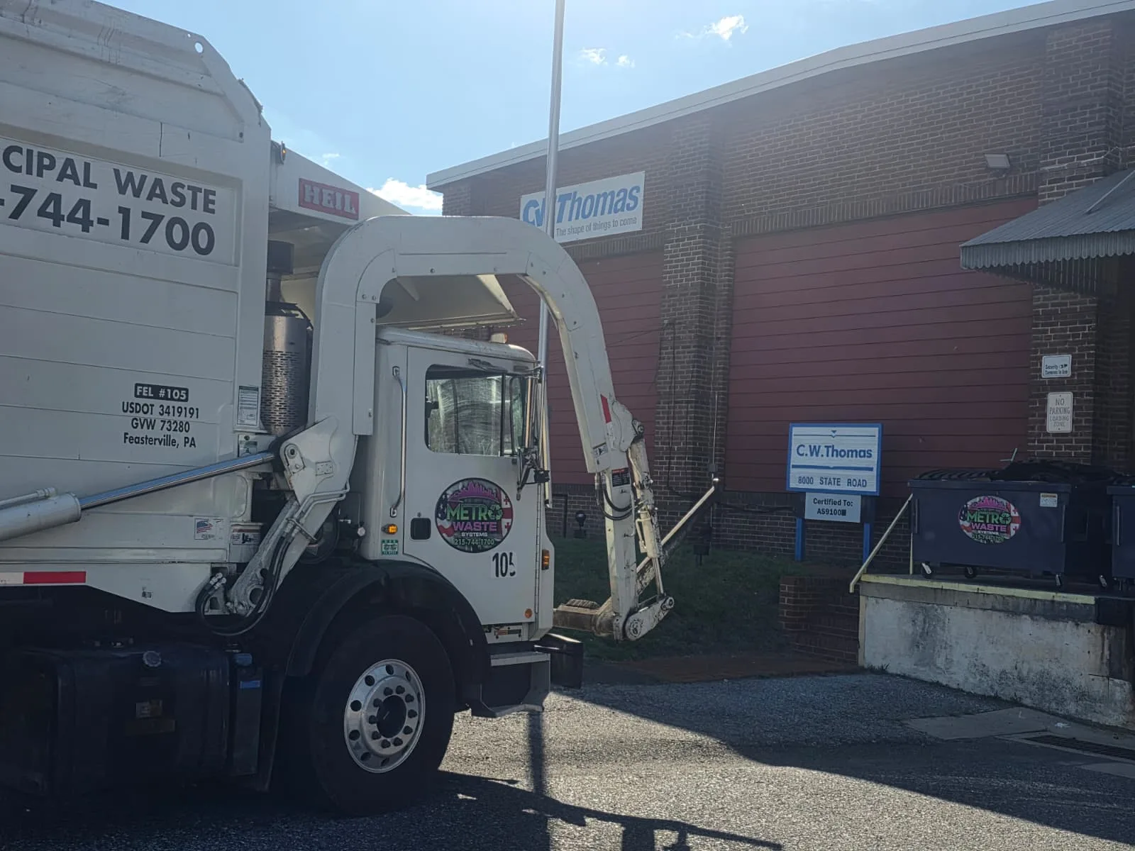 Front-load commercial dumpster service truck operated by Metro Waste Solutions in the Philadelphia area — image 4