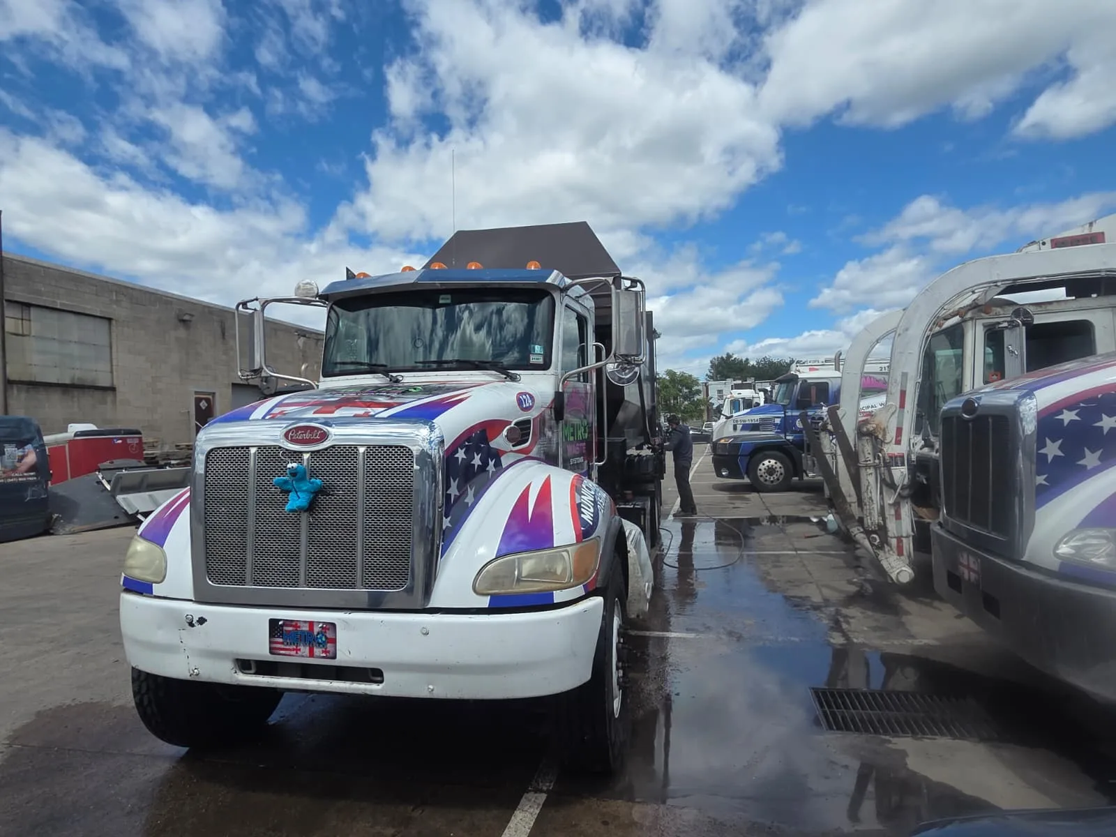Front-load commercial dumpster service truck operated by Metro Waste Solutions in the Philadelphia area — image 6