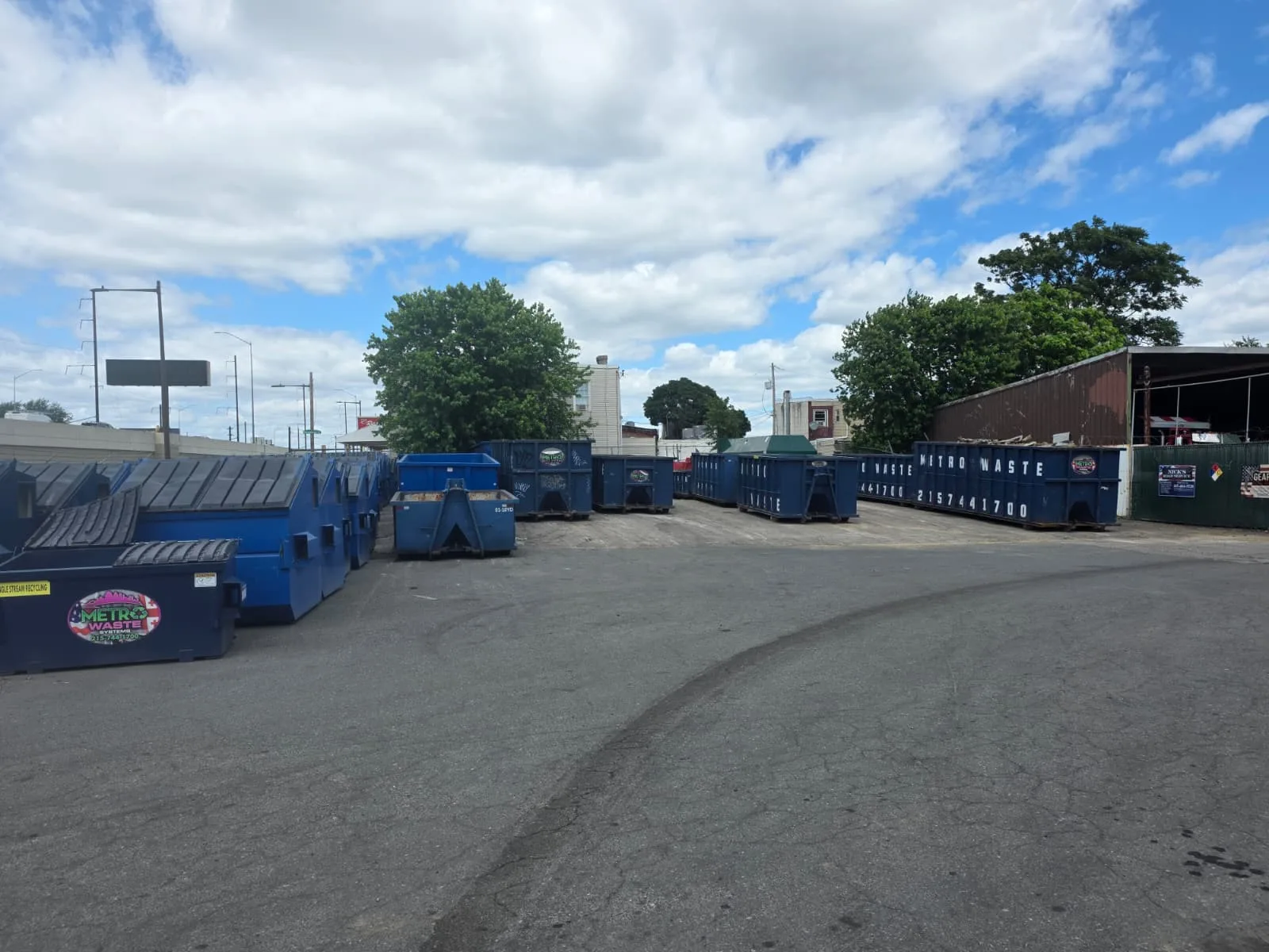 Heavy-haul tractor moving waste containers