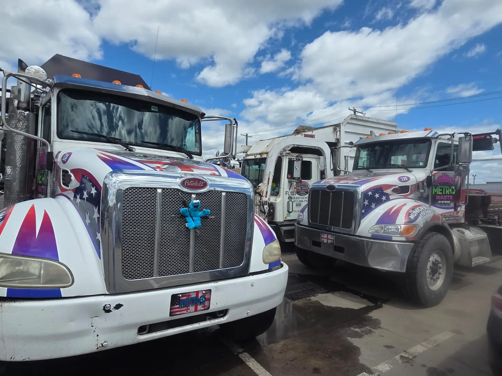 Rear-load commercial waste collection truck from Metro Waste Solutions on a Philadelphia metro route — photo 6