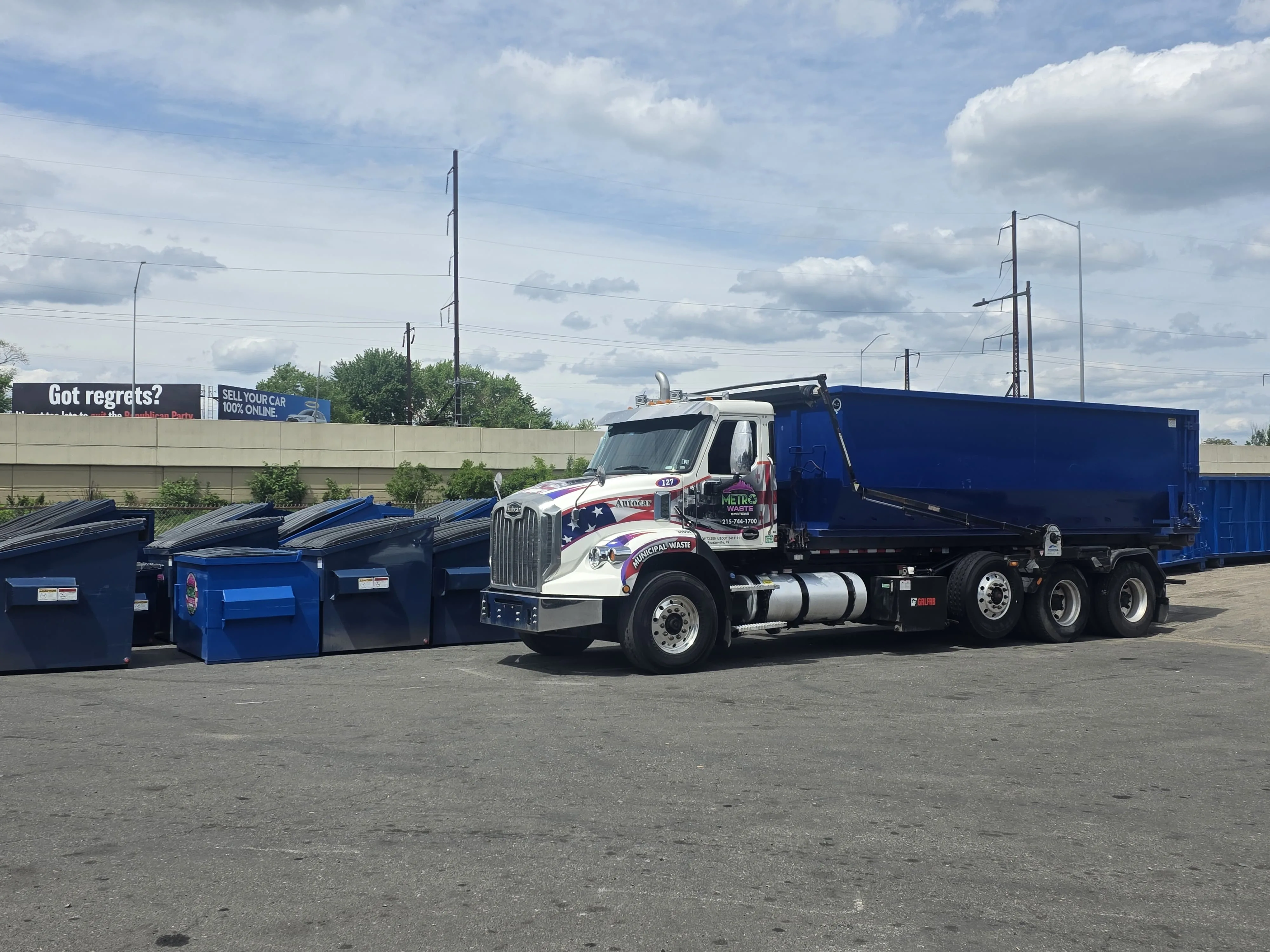 Rear-load commercial waste collection truck from Metro Waste Solutions on a Philadelphia metro route — photo 11