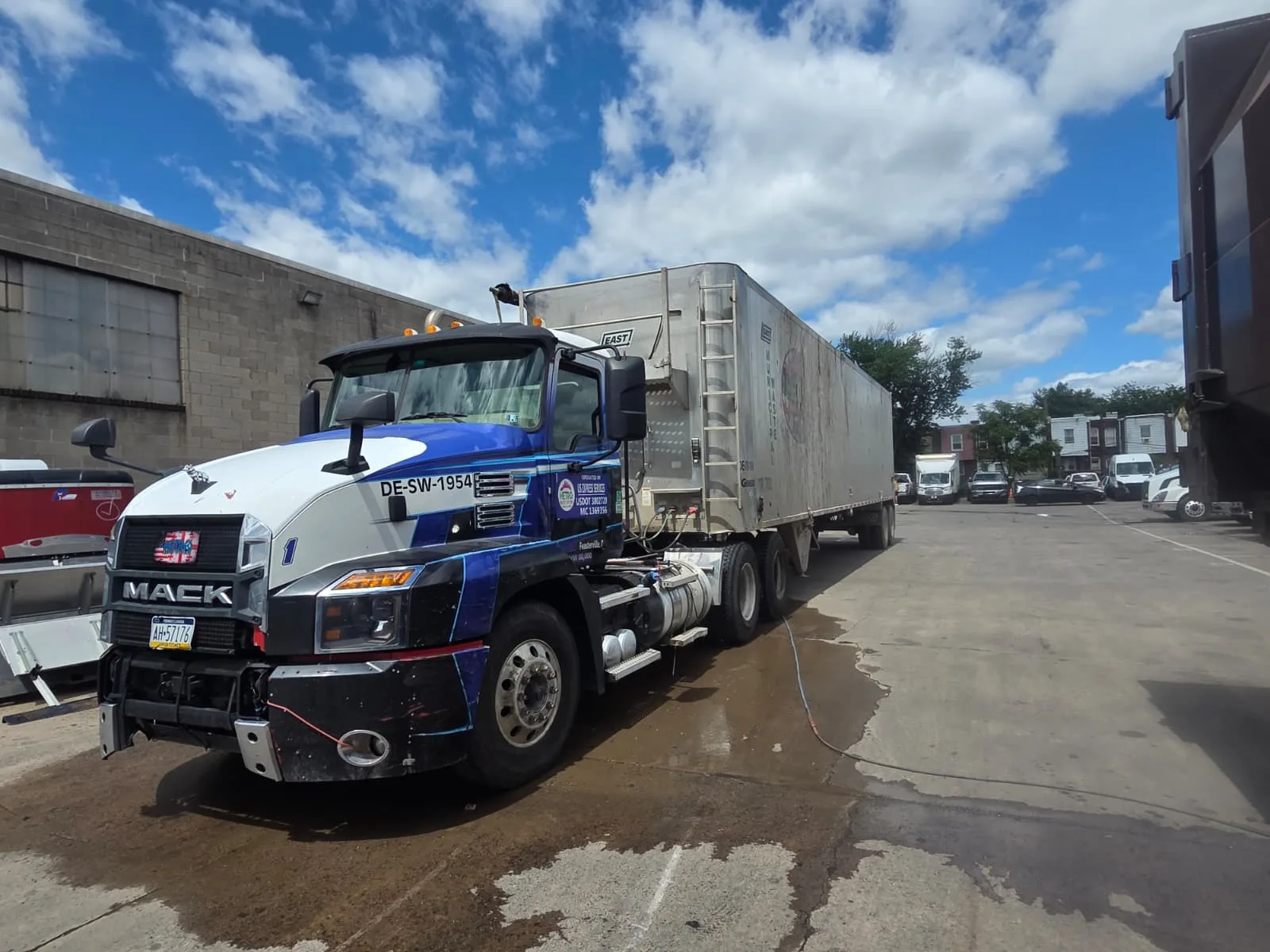 Roll-off dumpster delivery and open-top container placement by Metro Waste Solutions for construction and commercial projects — photo 6